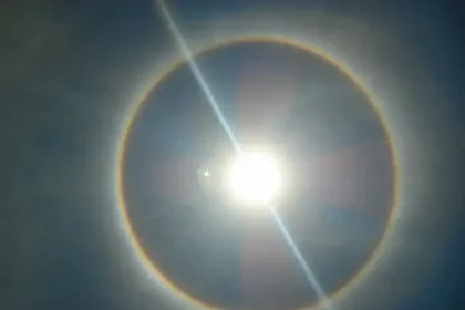 A photo of the sun with the rainbow ring around indicating heat