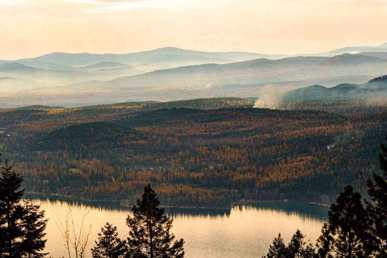 A beautiful nature scene looking down on a lake surrounded by trees