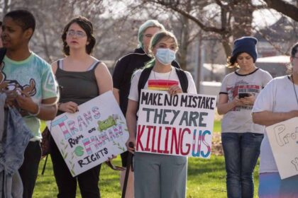 Lgbtq+ youth crisis a trans rights protest outside the kansas statehouse