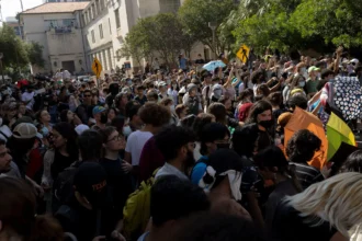 Protesters chant “off our campus” to law enforcement at the university of texas at austin on apr. 29, 2024.