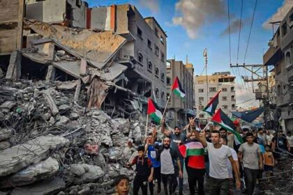 International criminal court prosecution of hamas: palestinians walk through the destruction in northern gaza.