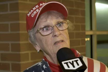 An elderly trump supporter with a shocked look on her face.