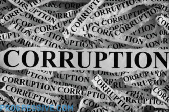 Gop healthcare scheme torn up pieces of paper in a pile with the word corruption printed on them