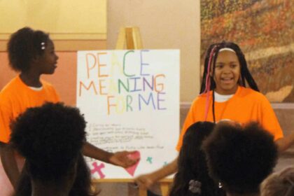 Participants of the peace camp demonstrate their dance for peace june 28, 2024, at the kansas statehouse.