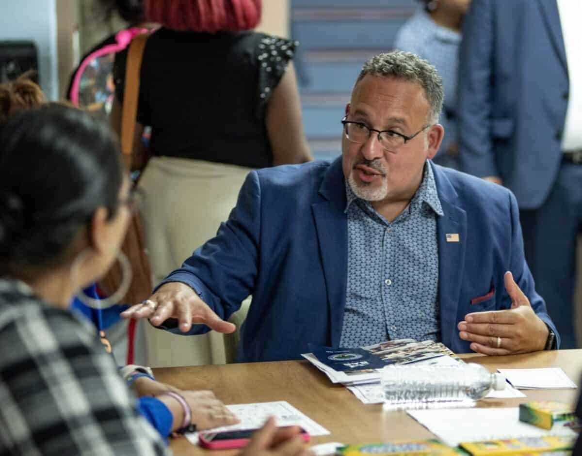Title IX rule U.S. Secretary of Education Miguel Cardona speaks with families at the Mattie Rhodes Center in Kansas City
