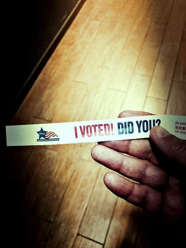 45701309702 314288dacf c Hand holding a sticker that says, i voted. Did you?