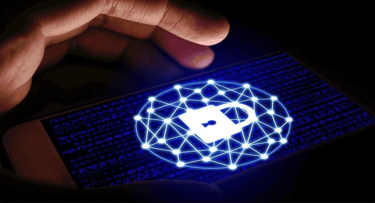 494b8456 e0ab 43d6 b4e4 667419680025 Cybersecurity threats. Hand about to tap a lit up padlock on a touchscreen