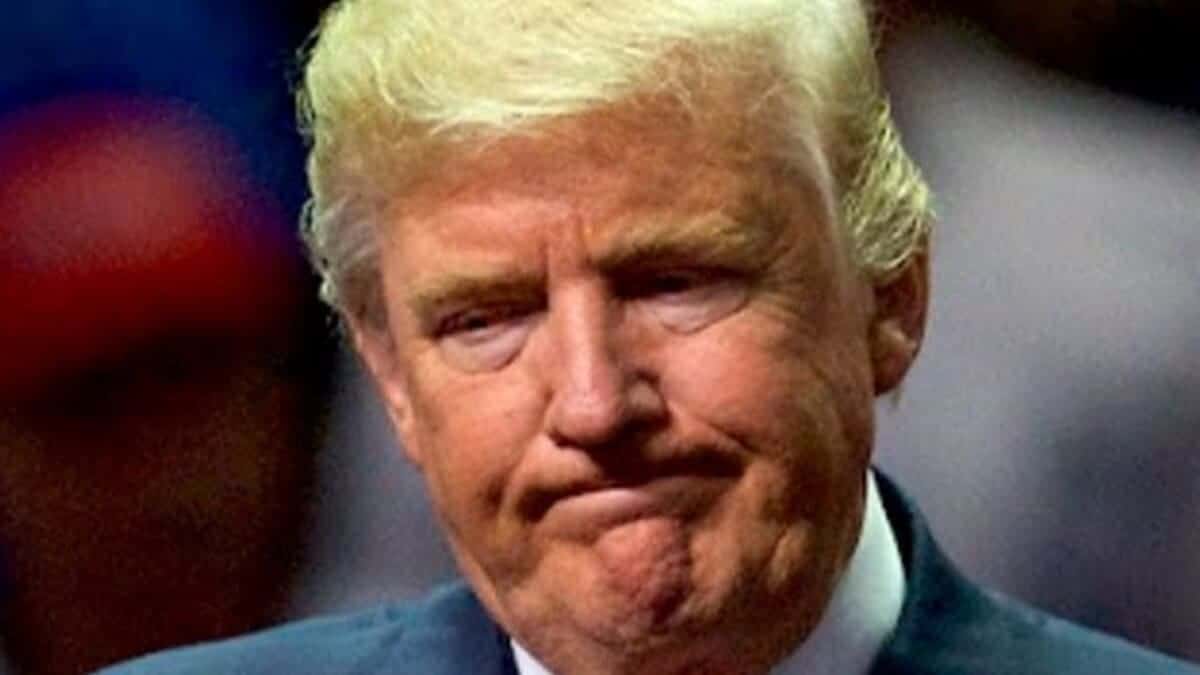 Donald trump with a regretful expression on his face