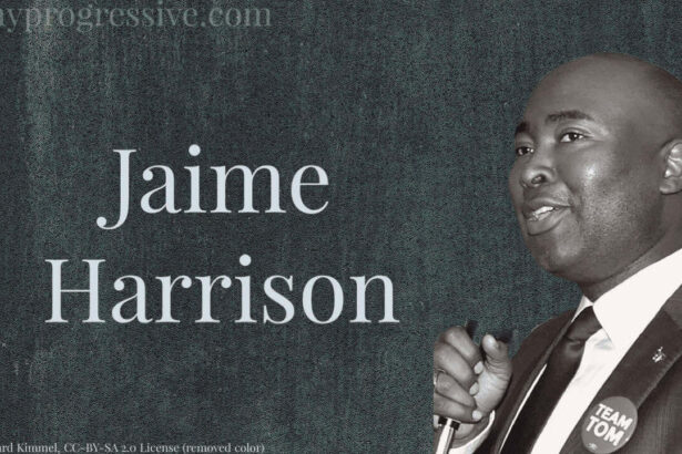 Photo of jamie harrison in black and white on a dark gray background