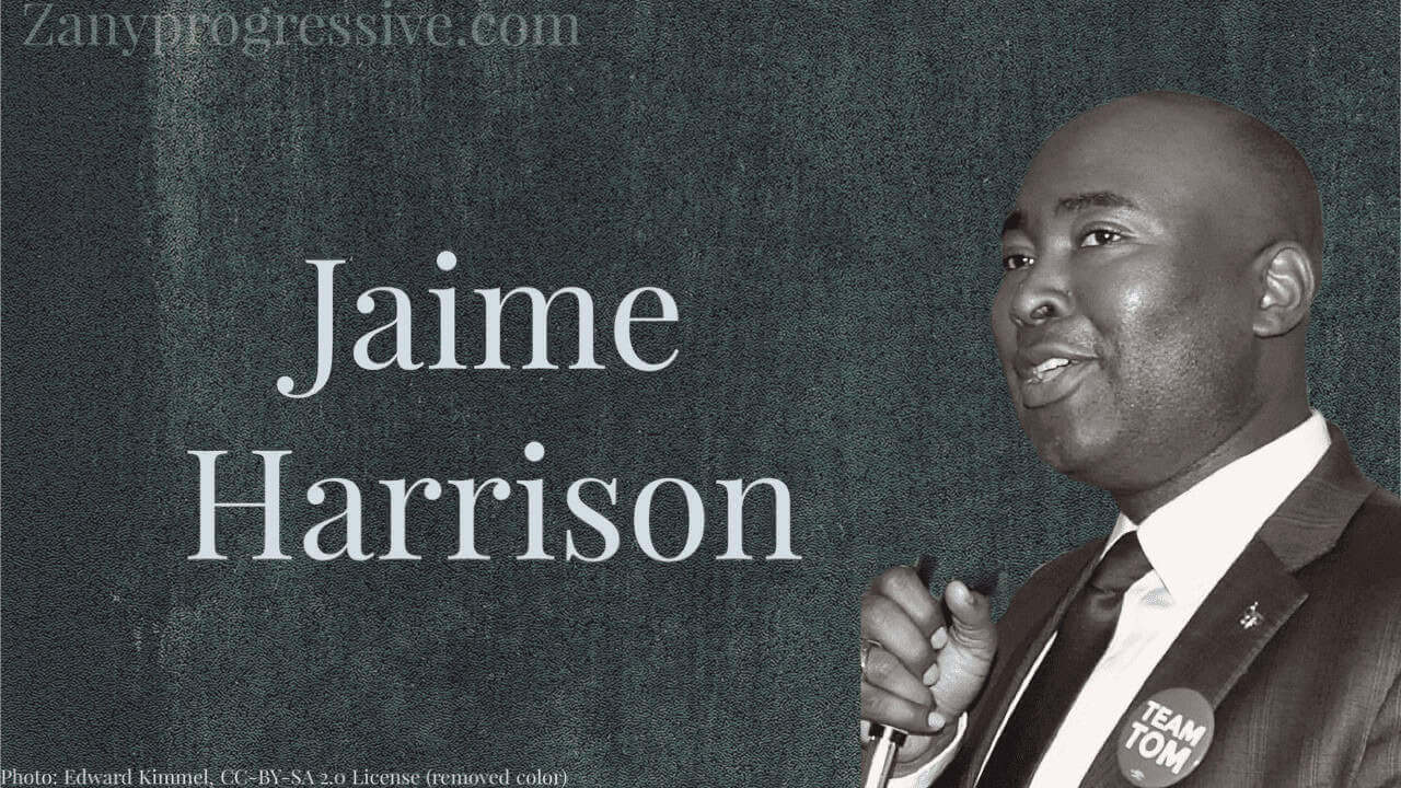 Photo of Jamie Harrison in black and white on a dark gray background