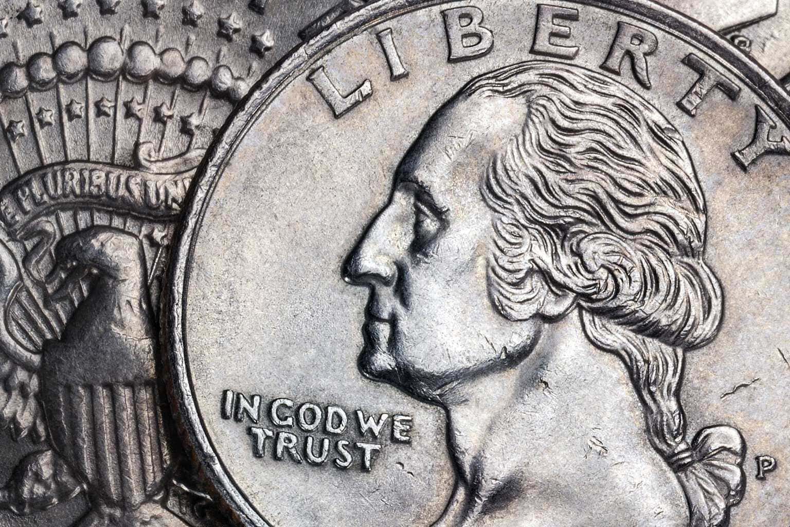 Close up of an american coin with the words in god we trust on it.