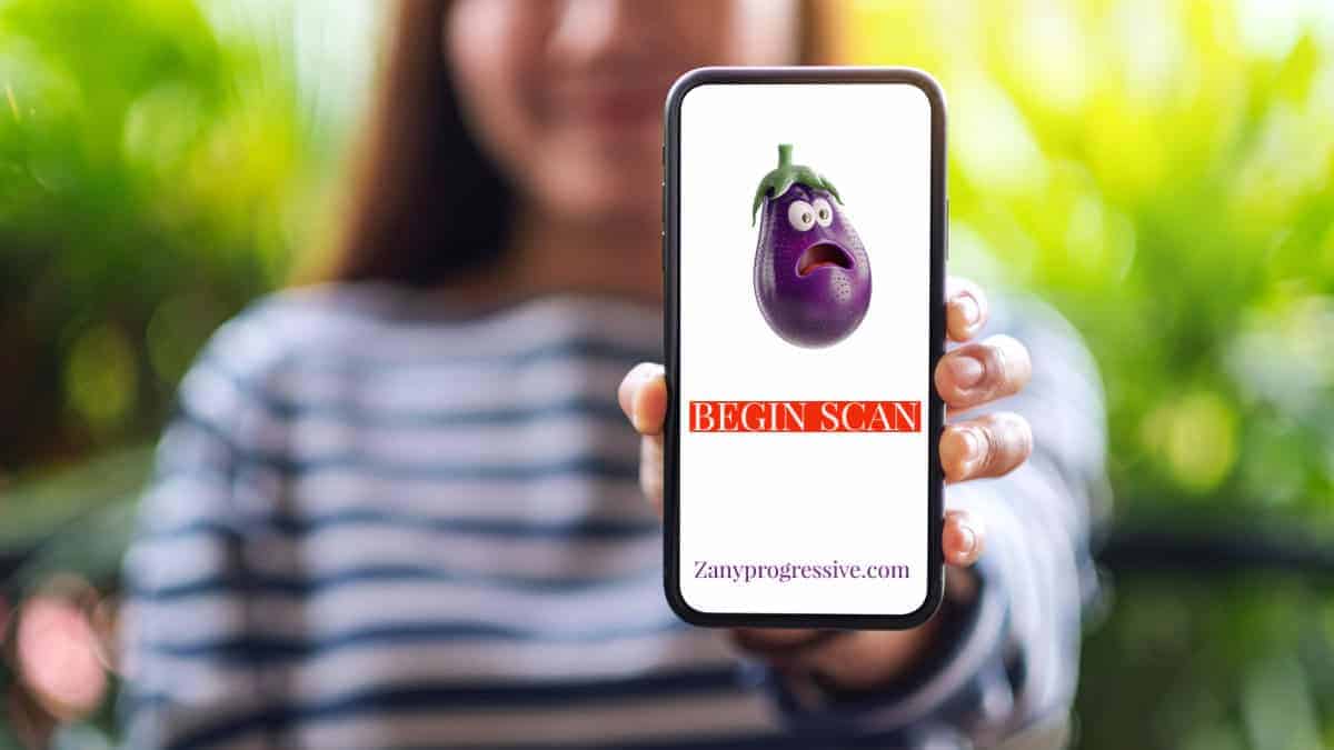 Phone app uses ai to scan for stis a woman holds a cell phone in front of her with the screen facing the camera. A cartoon eggplant emoji looks scared with button underneath begin scan