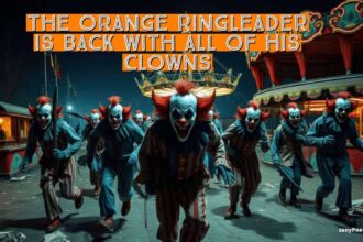 Scary clowns walking towards the camera at a carnival at night