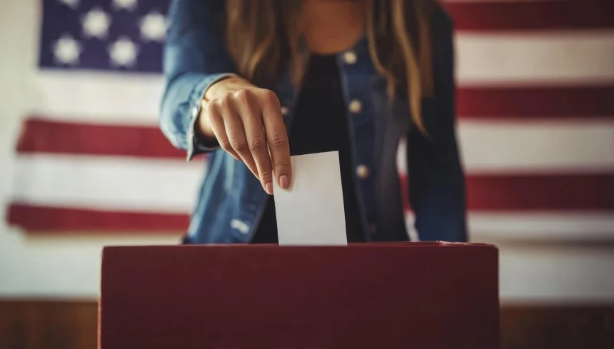 Woman putting a ballot in a ballot box