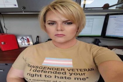 Transgender veteran wearing a shirt that says i fought for your right to hate me
