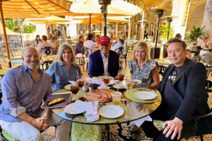 President-elect donald trump, center, sits with, left to right, businessman howard lutnick; iowa u. S. Sen. Joni ernst; ernst chief of staff lisa goeas; and billionaire entrepreneur elon musk at mar-a-lago, trump’s florida estate.