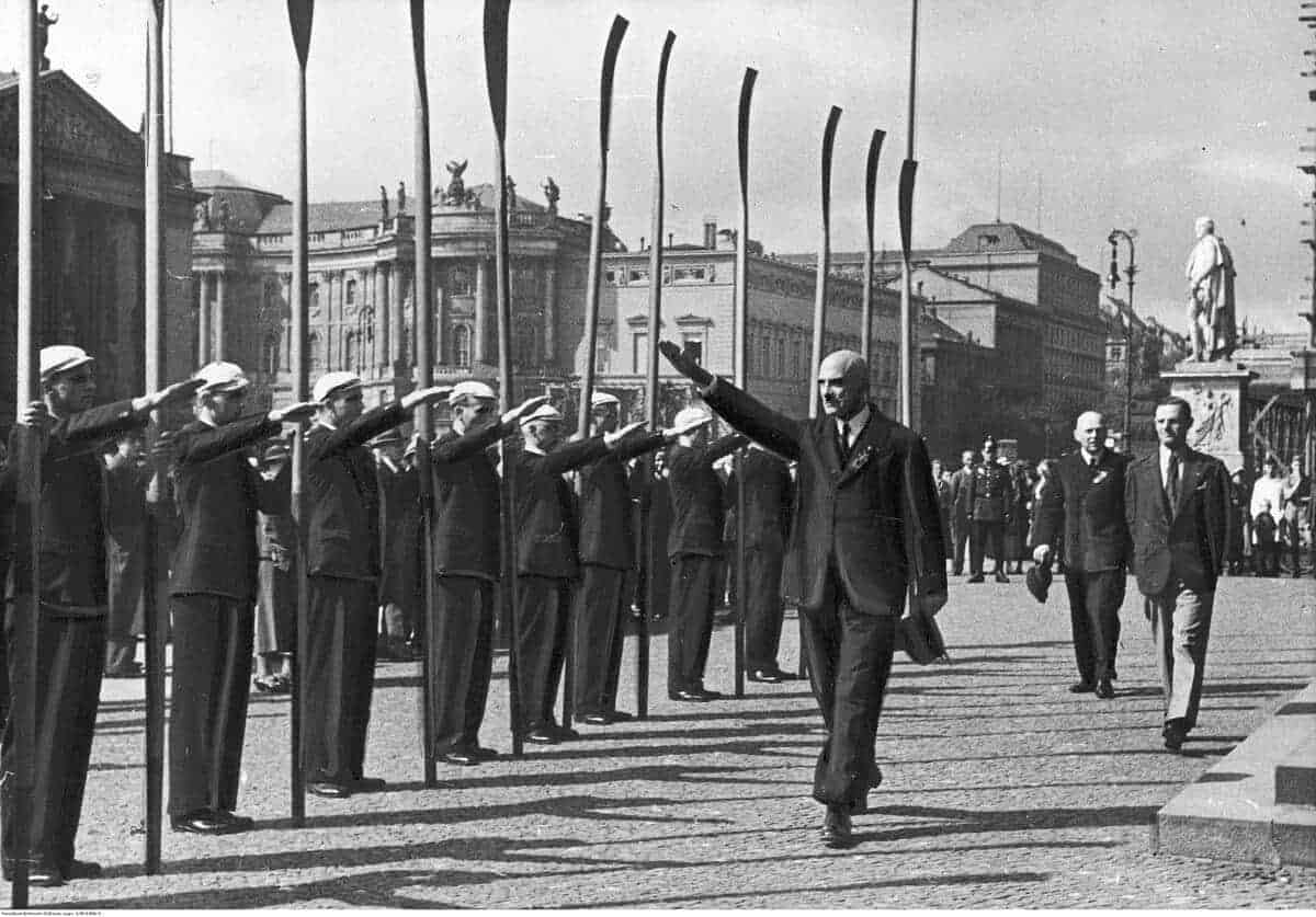 1935 european rowing championships in berlin: rico fioroni, the president of fisa, gives a nazi salute to rowing delegates before laying a wreath on the tomb of the unknown soldier.