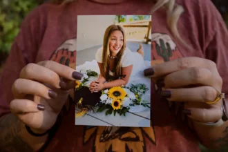 Mother holds photo of 18-year-old daughter who died in texas