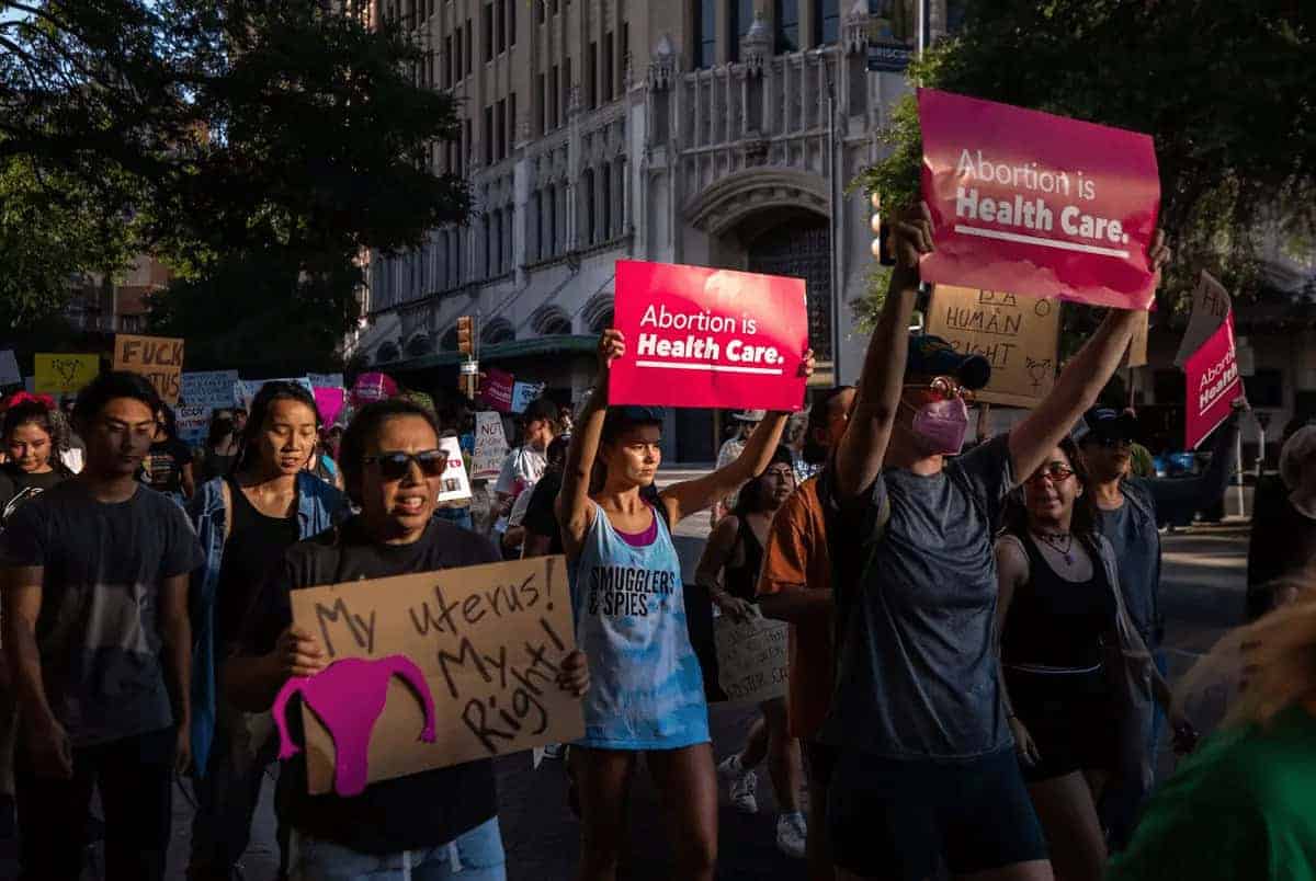 Thousands of people walk in a march in support of abortion rights near downtown san antonio