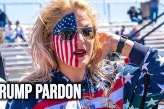 A trump supporter with half of her face painted as an american flag