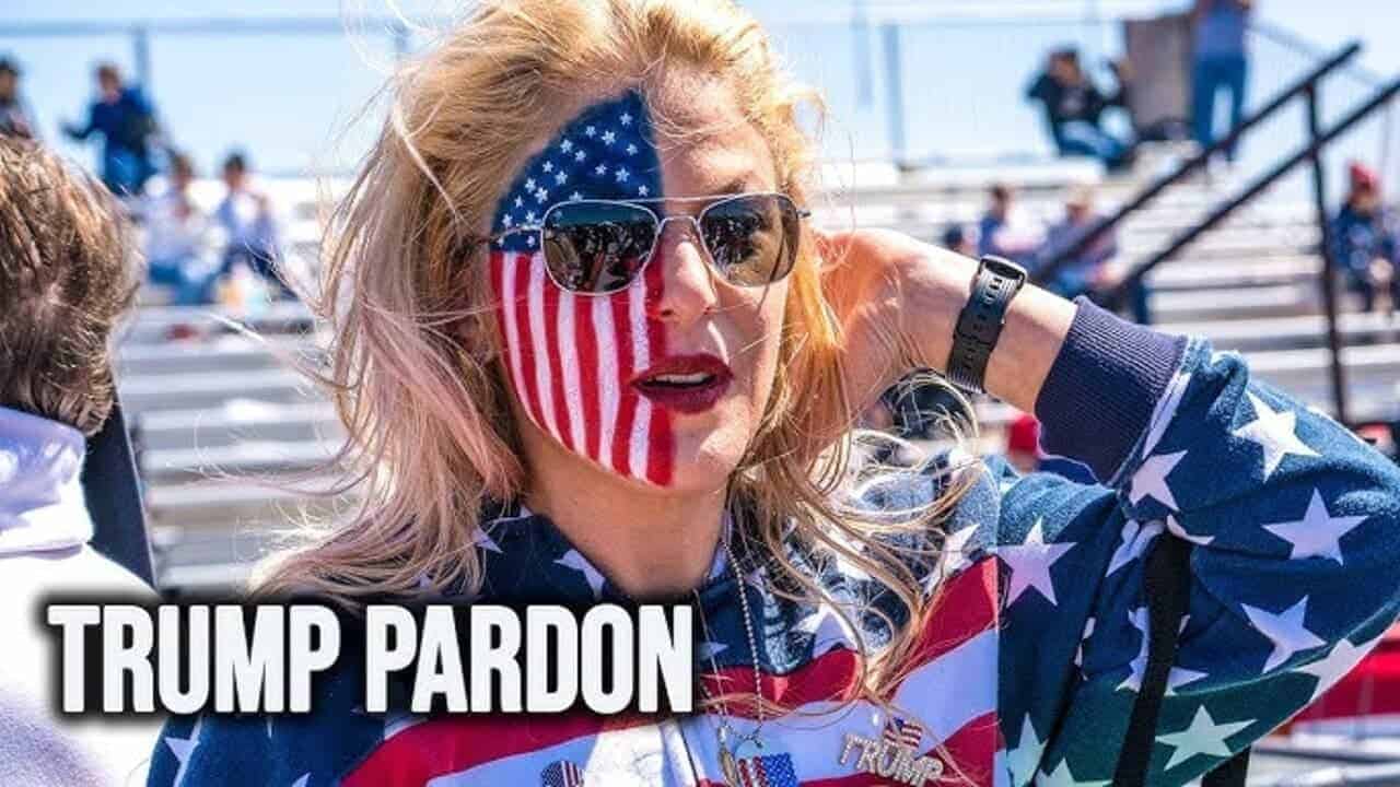 A trump supporter with half of her face painted as an american flag