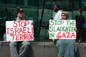 2 people protesting the slaughter in gaza