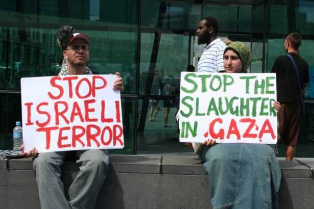 2 people protesting the slaughter in gaza