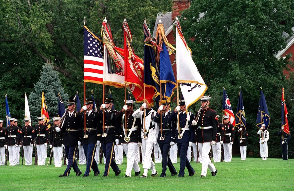 The en:Joint Service Color Guard advances the colors during the retirement ceremony of Chairman of the Joint Chiefs of Staff Gen. Henry H. Shelton, at Fort Myer, Va., on Oct. 2, 2001. DoD photo by Helene C. Stikkel.