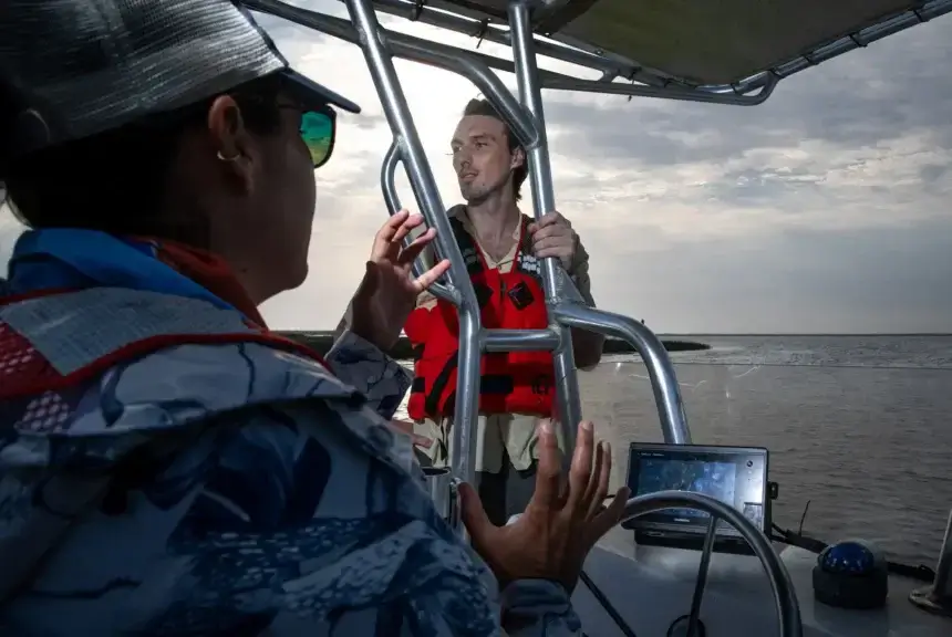 Victoria Congdon, a marine scientist with Mission-Aransas National Estuarine Research Reserve, and Max Portmann, a doctorate student at Texas A&M-Corpus Christi, talk about coastal ecology on April 18, 2024, in Port Aransas.