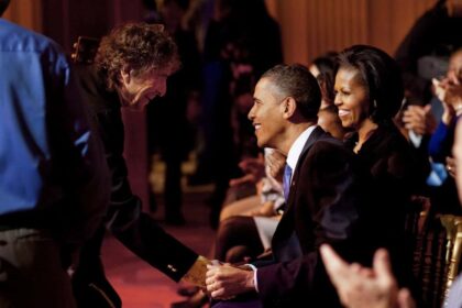 Bob dylan shakes hands with barack obama after a performance at the white house.