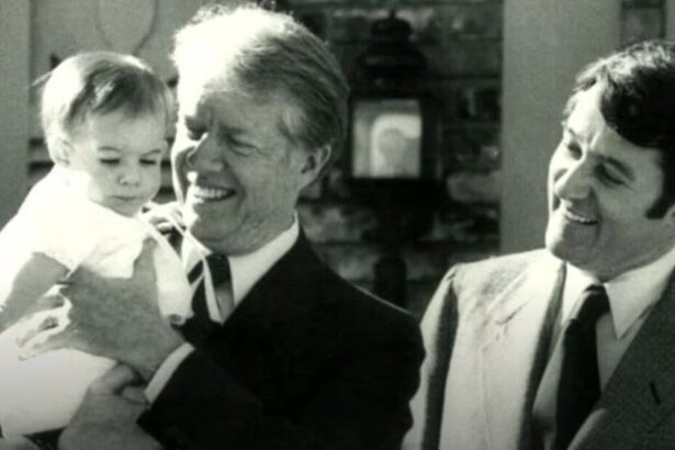 Jimmy carter holding mayor larry wade's daughter, elizabeth in 1979 during a visit to elk city, ok.