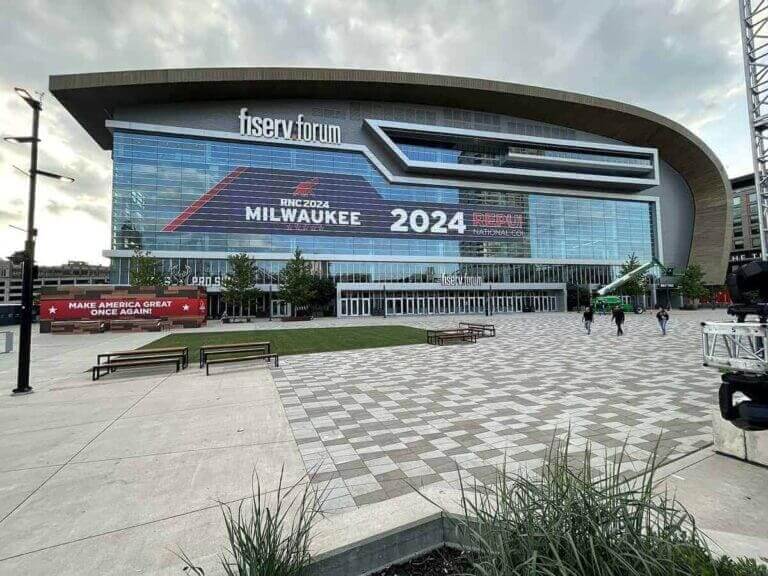 2024 RNC event building in Milwaukee. The crowd held up pre-made signs provided by the campaign that said MASS DEPORTATION NOW