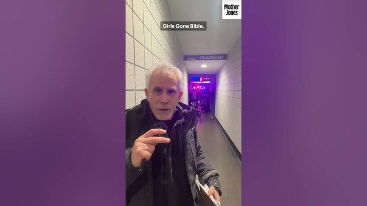 Celebrity speaking to the camera at a trump rally