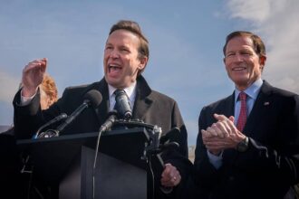 Senator chris murphy speaks in front of the capitol