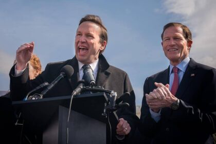 Senator chris murphy speaks in front of the capitol