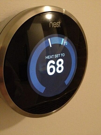 Eco-friendly smart thermostat on a wall by nest