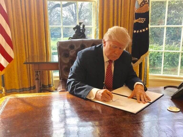 Donald trump signing an executive order