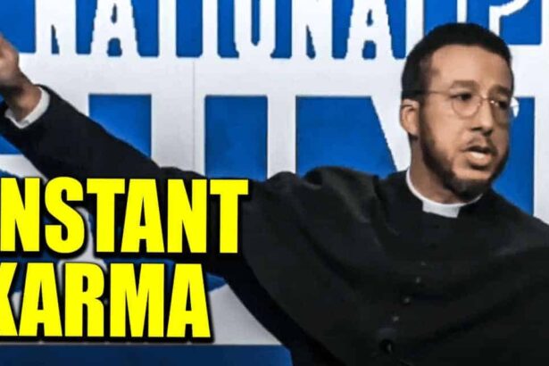 A priest wearing the long black robe doing the nazi salute on stage