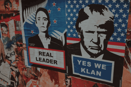 Posters and graffiti on a building in mexico. Posters feature mexican and u. S. Leaders. Mexican president’s poster says real leader. Donald trump poster sats yes we klan