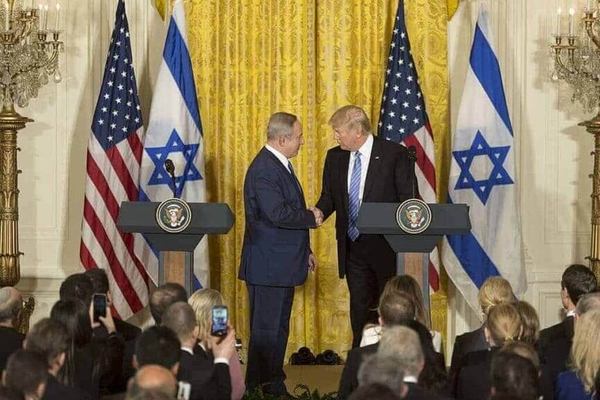 War with iran. President trump and benjamin netanyahu shake hands during a white house press conference.