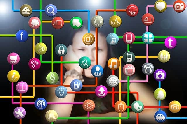 how children and teens use social media affects them emotionally. Sad teen girl with social media logos in front of her