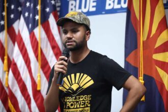 Maxwell frost at a campaign event for harris