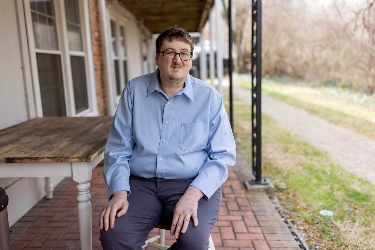 Eric sits on porch to discuss medicaid work requirements