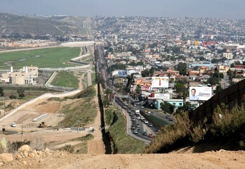 View of the border wall splitting the u. S. And mexico