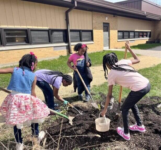Usda cuts school kids working in a garden outside their elementary school.