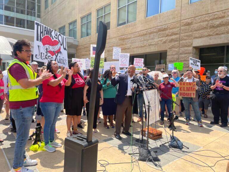 Protestners gather outside the court of Judge Paula Xinis