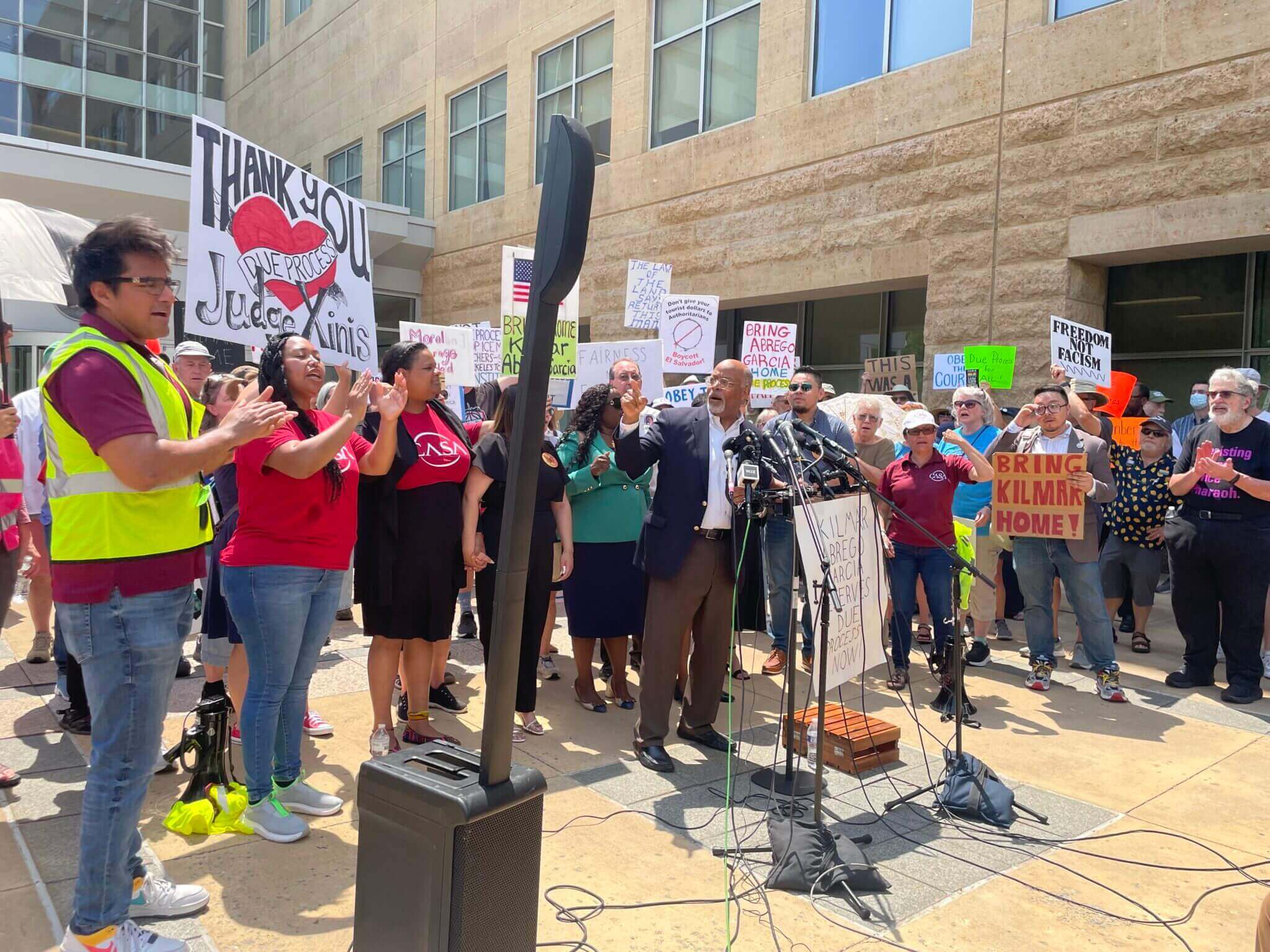 Protestners gather outside the court of judge paula xinis