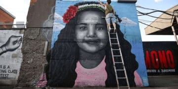 Mural of Hind Rajab on the exterior of a building. The paramedic massacre was happening back when she was killed.