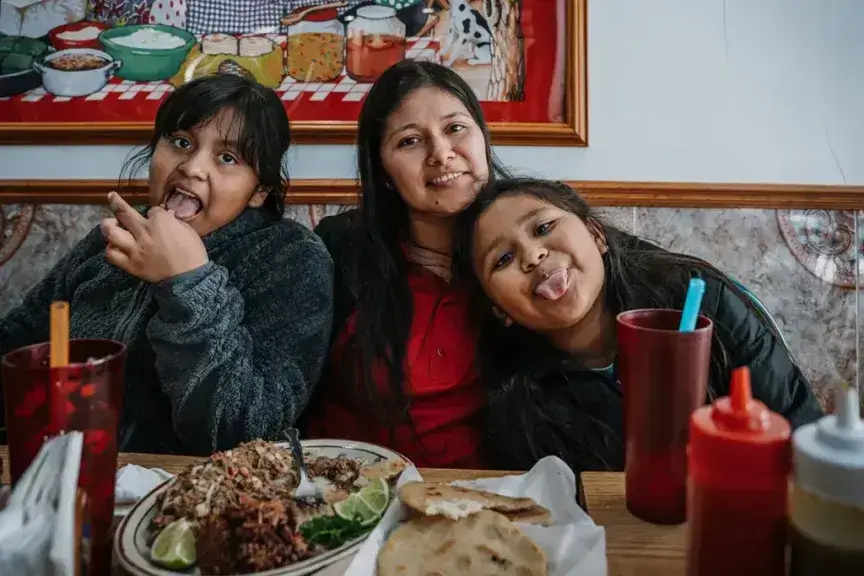 Yessenia ruano and her kids at a restaurant