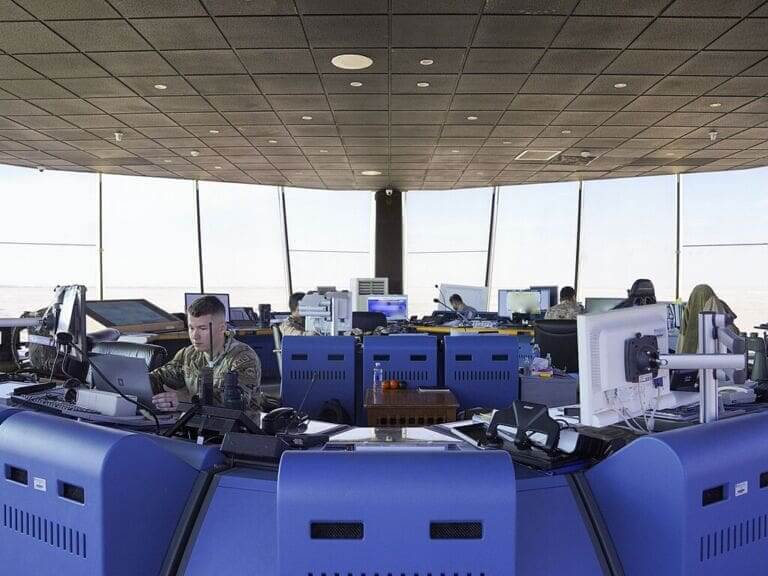 Air traffic controllers working in a tower.